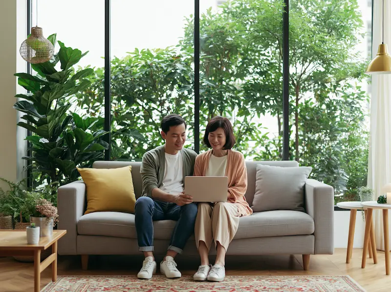 Choosing between online and in-person counseling, split scene with home and therapy office, concept of choice and accessibility, editorial image.