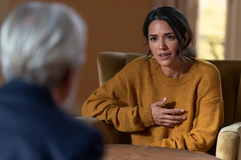 Woman showing a counselor where she feels anxiety in her body during a session in Arizona